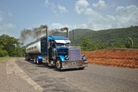 peterbilt with black smoke hauling
tanker