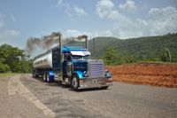 peterbilt with black smoke hauling
  tanker